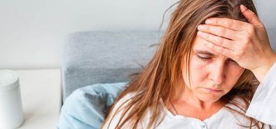 woman feeling poorly with hand on head - sick pay ssp (bs393159908)_web_1600x500.jpg